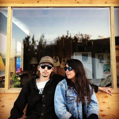 Parker Schnabel and Sheena Cowell took a picture outside a cafe with Cowell under Schnabel's arm.